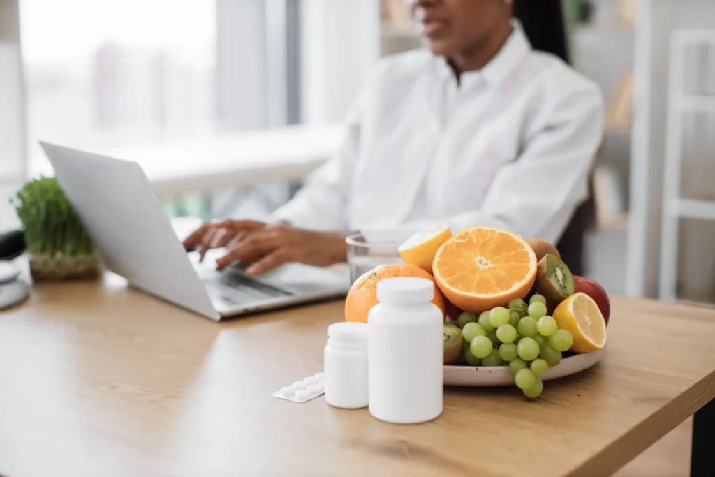 fruits and medicine being placed on desk at nutrit 2024 12 13 14 10 42 utc