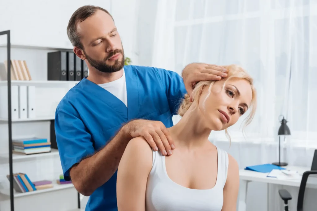 portrait of chiropractor stretching neck of woman 2024 11 18 12 38 43 utc